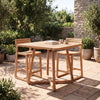A square outdoor dining set with a light natural wood table and four matching bar-height stools, placed on a stone patio in a garden setting.